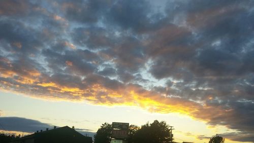 Low angle view of cloudy sky at sunset