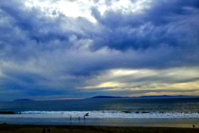 Scenic view of sea against cloudy sky