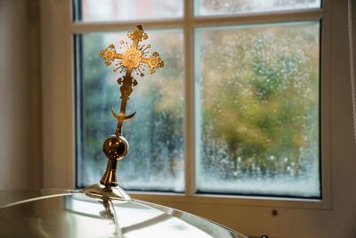 Close-up of flower vase on table at home