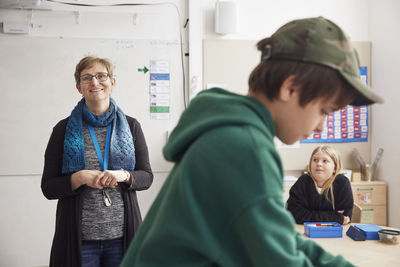 Smiling teacher in classroom