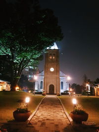 Illuminated cathedral against sky at night