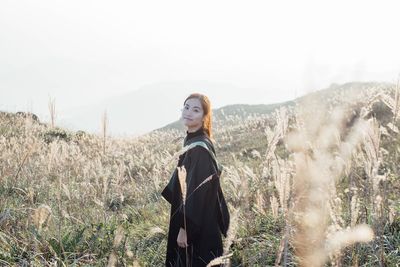 Silhouette of woman standing on landscape