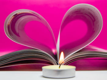 Close-up of heart shape on book