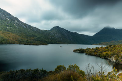 Scenic view of lake and mountains against sky