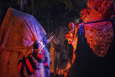 Panoramic shot of people holding burning at night