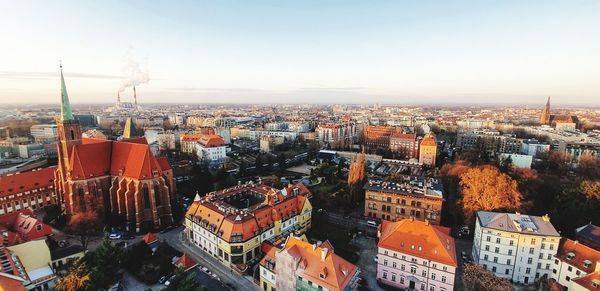 High angle view of buildings in city against clear sky