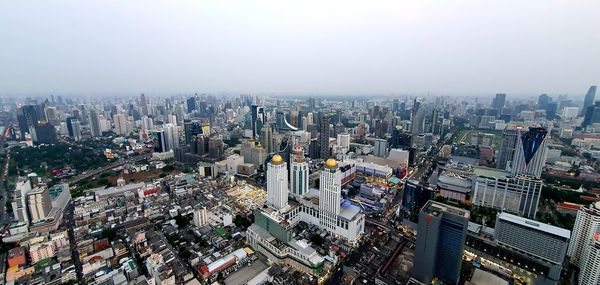 High angle view of city buildings against sky