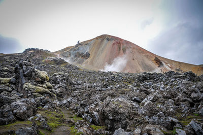 Scenic view of volcanic mountain against sky