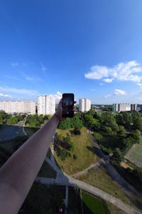 View of cityscape against blue sky