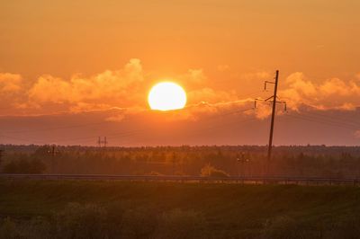 Scenic view of field against sky during sunset