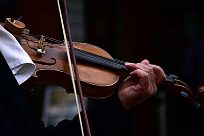 Close-up of hands playing guitar