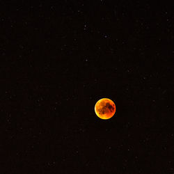 Low angle view of moon against sky at night