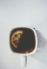 Close-up of coffee cup on white background