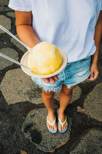 Low section of person holding ice cream