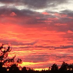 Low angle view of cloudy sky at sunset