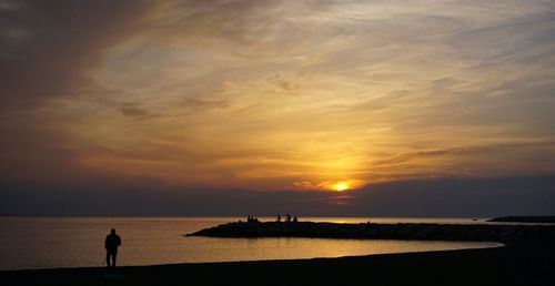 View of lake against sky during sunset