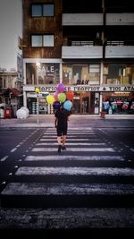 Full length of woman standing in city