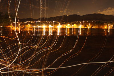 Light trails against sky at night