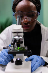 Close-up of scientist experimenting at lab