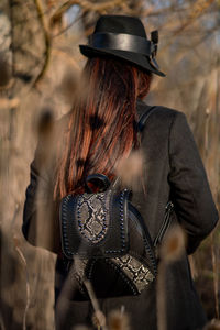 Rear view of woman wearing hat