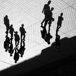 High angle view of people walking on floor