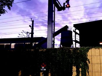 Low angle view of street lights against sky