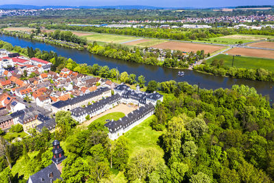 High angle view of river and trees in city