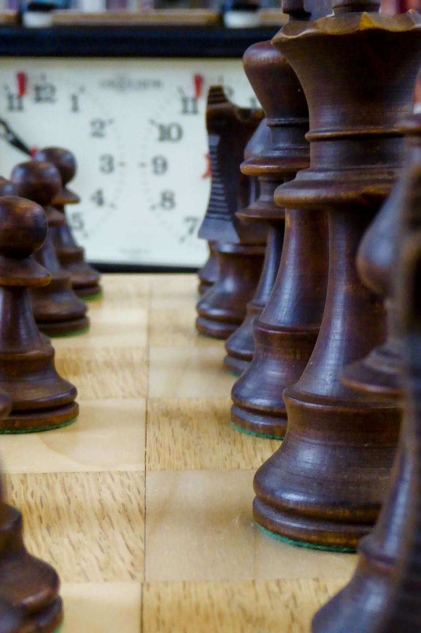 FULL FRAME SHOT OF CHESS PIECES ON FLOOR