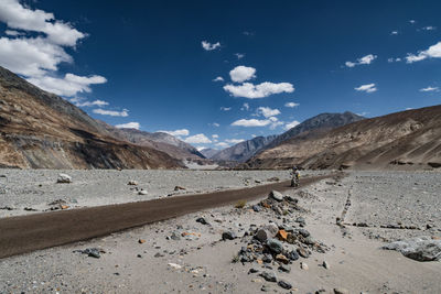 View of calm lake against mountain range