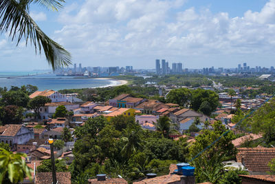 High angle view of city buildings against sky