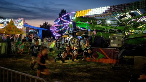 People enjoying in amusement park