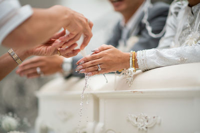 Midsection of man washing hands