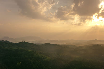 Scenic view of landscape against sky during sunset