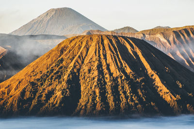 Scenic view of volcanic mountain against sky