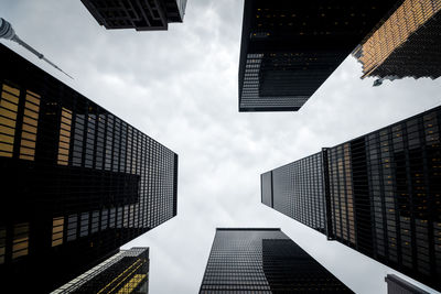 Low angle view of skyscrapers against sky in city