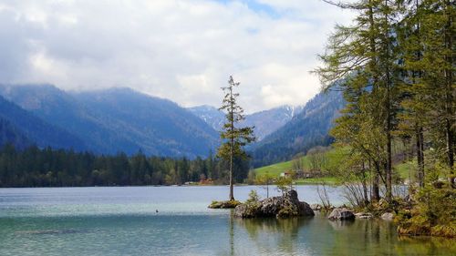 Scenic view of lake and mountains against sky