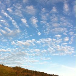 Scenic view of landscape against cloudy sky