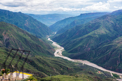 Scenic view of mountains against cloudy sky at chicamocha canyon