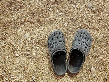 High angle view of shoes on sand