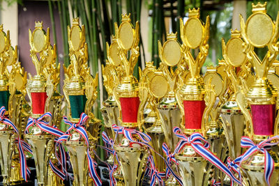 Close-up of trophies at market stall