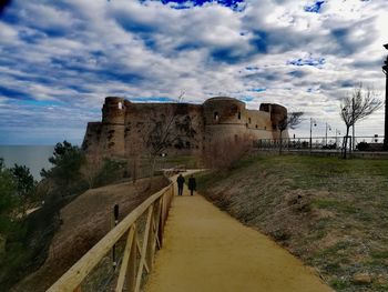 View of historic building against cloudy sky