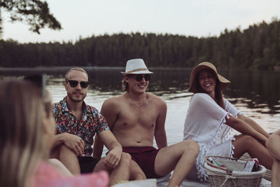 Friends relaxing at lake