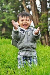 Portrait of smiling boy on grass