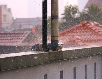 Close-up of wet window in rainy season