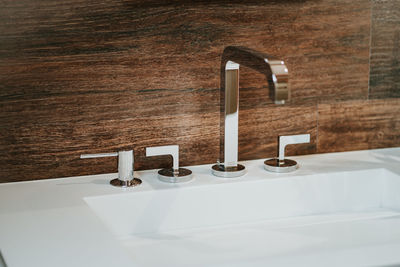 Close-up of faucet in bathroom