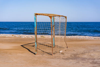 Lifeguard hut on beach against clear sky