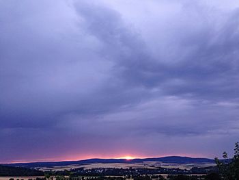 Scenic view of landscape against cloudy sky