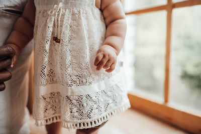 Midsection of woman holding hands