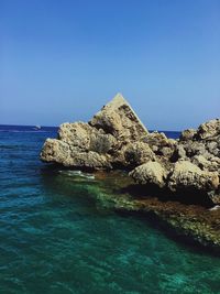 Scenic view of sea against clear blue sky