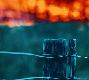 Close-up of fence in the sunrise